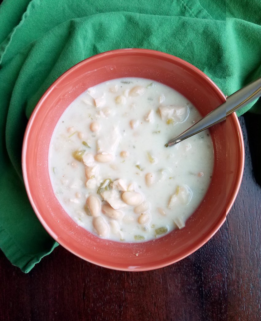 bowl of creamy white chicken chili with spoon.