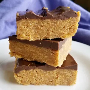 stack of peanut butter corn flake squares with chocolate topping.