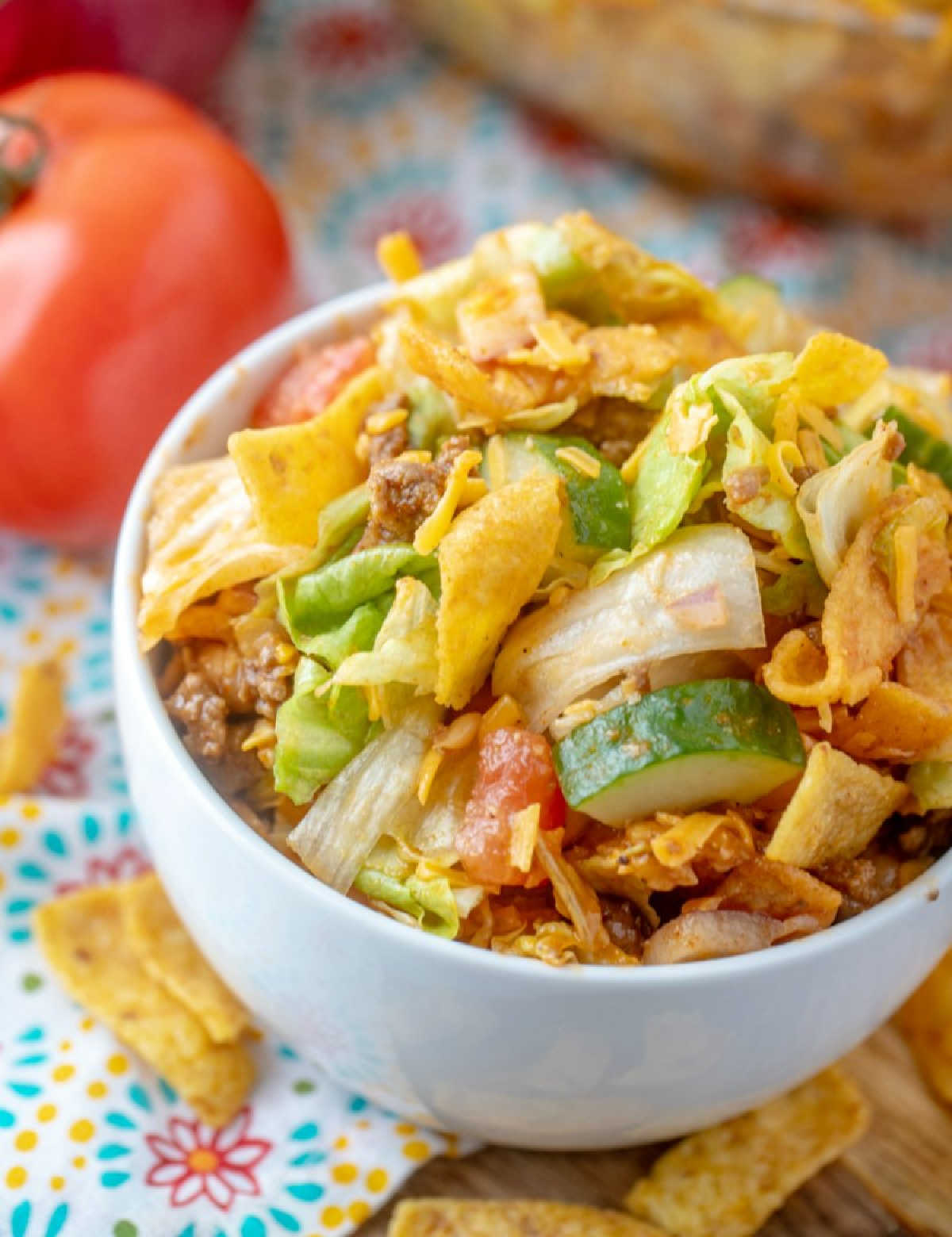 looking down at a bowl of frito taco salad, served and ready to eat.