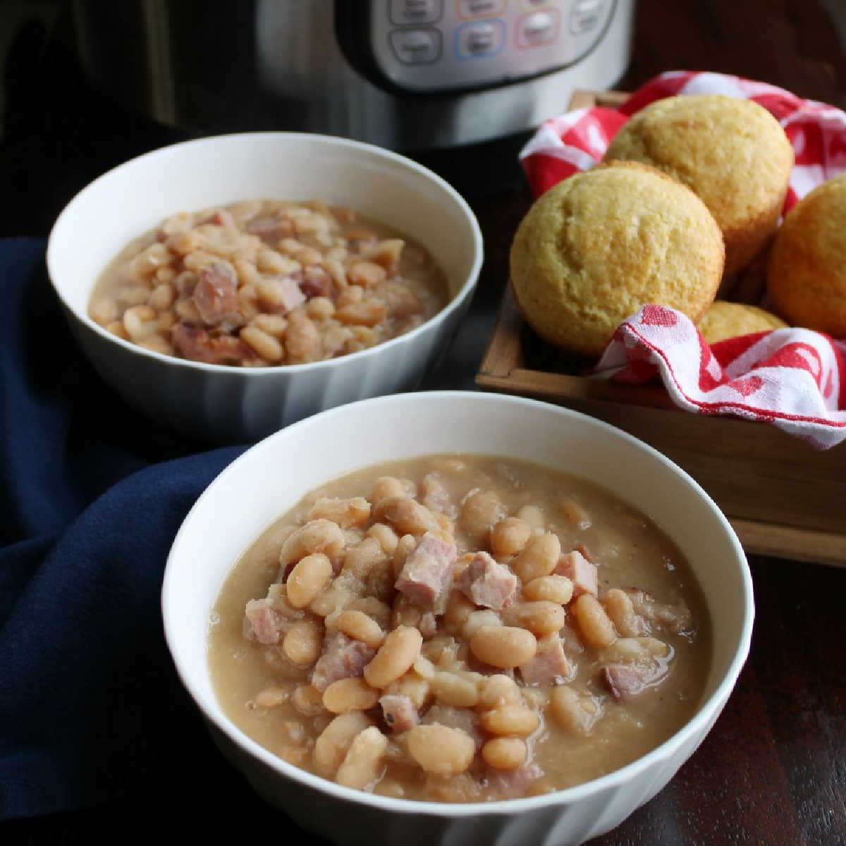 bowls of ham and beans with corn muffins and instant pot.