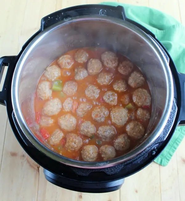 steamy hot swiss steak meatballs in instant pot.