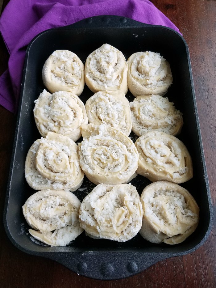 coconut cinnamon rolls in pan and ready to rise.