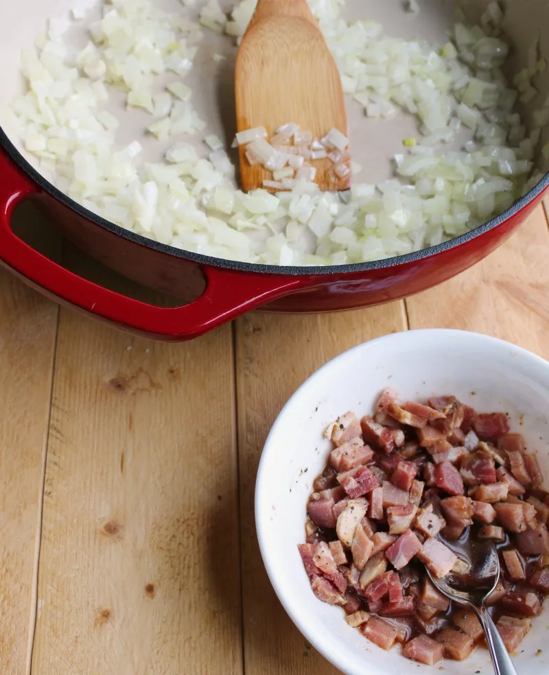 pan with diced onions and bowl with marinating bits of pork.