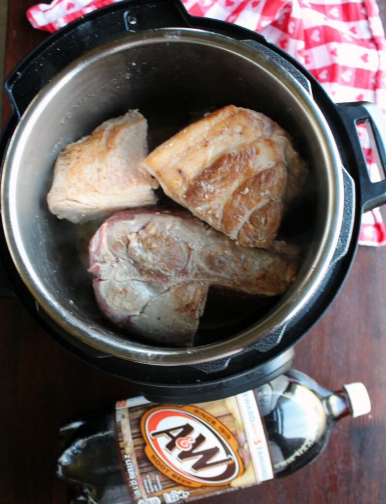browned pieces of pork in instant pot with a 2 liter of root beer.