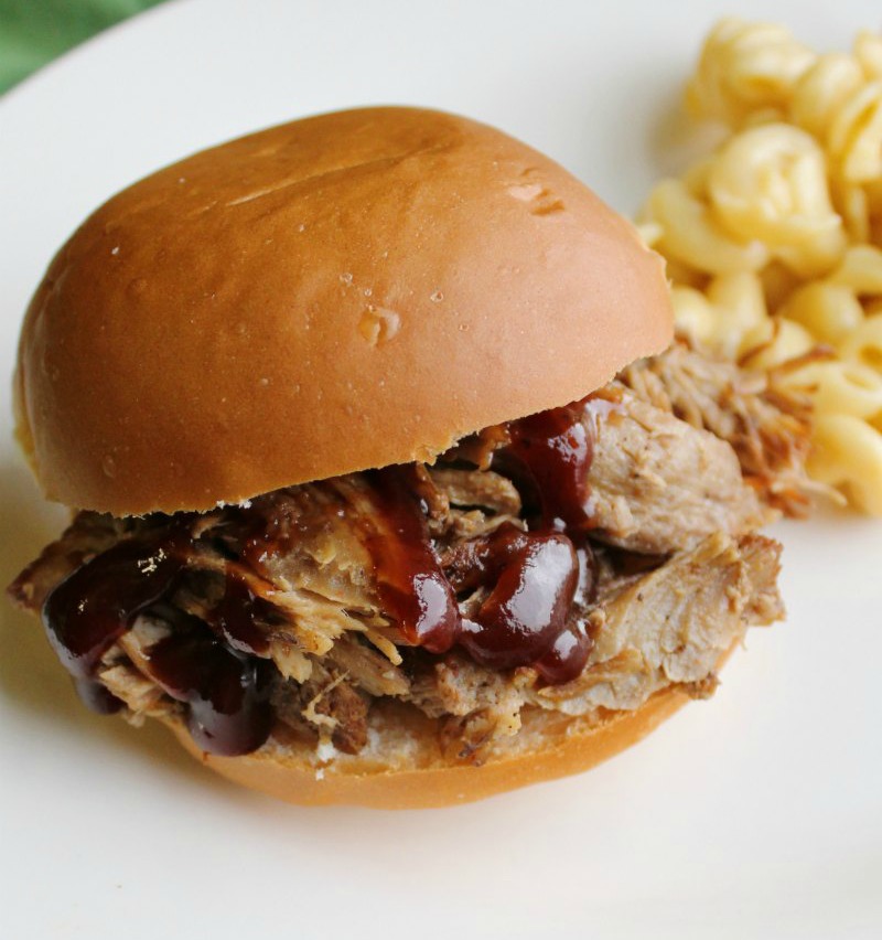 close up of a pulled pork sandwich with bbq sauce