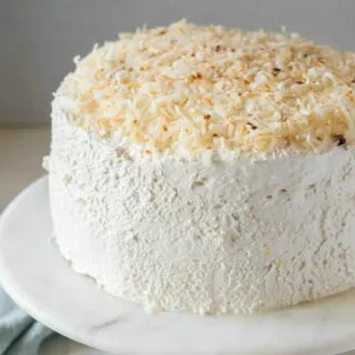 Haleakala cake with fluffy white frosting and toasted coconut.