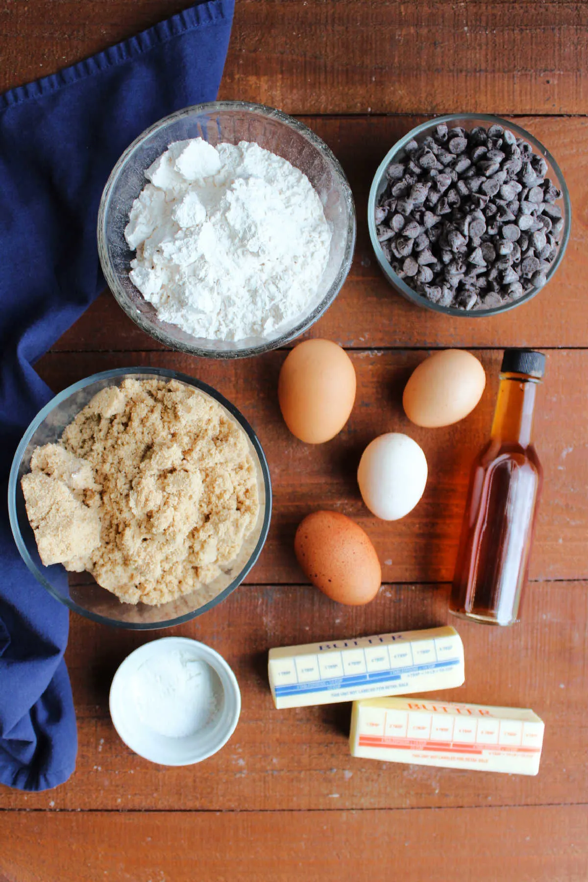 Ingredients including brown sugar, flour, chocolate chips, eggs, vanilla, butter, baking powder, and salt.