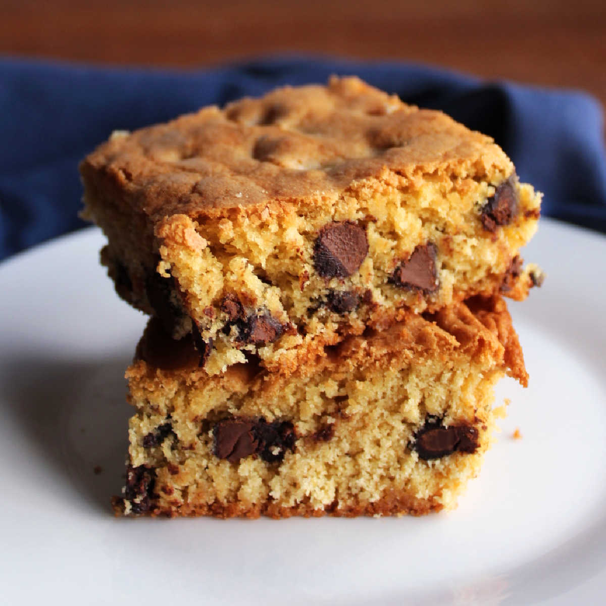 Two pieces of brown sugar bars stacked on top of each other showing the soft texture and the chocolate chips inside.