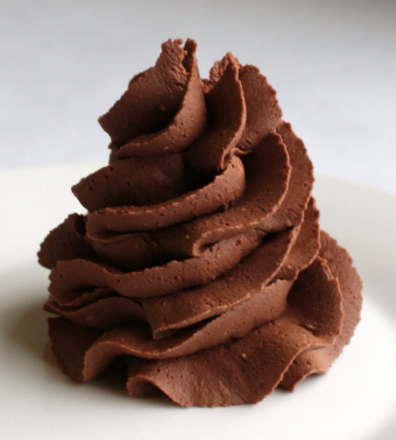 swirl of super chocolaty darker in color chocolate buttercream frosting