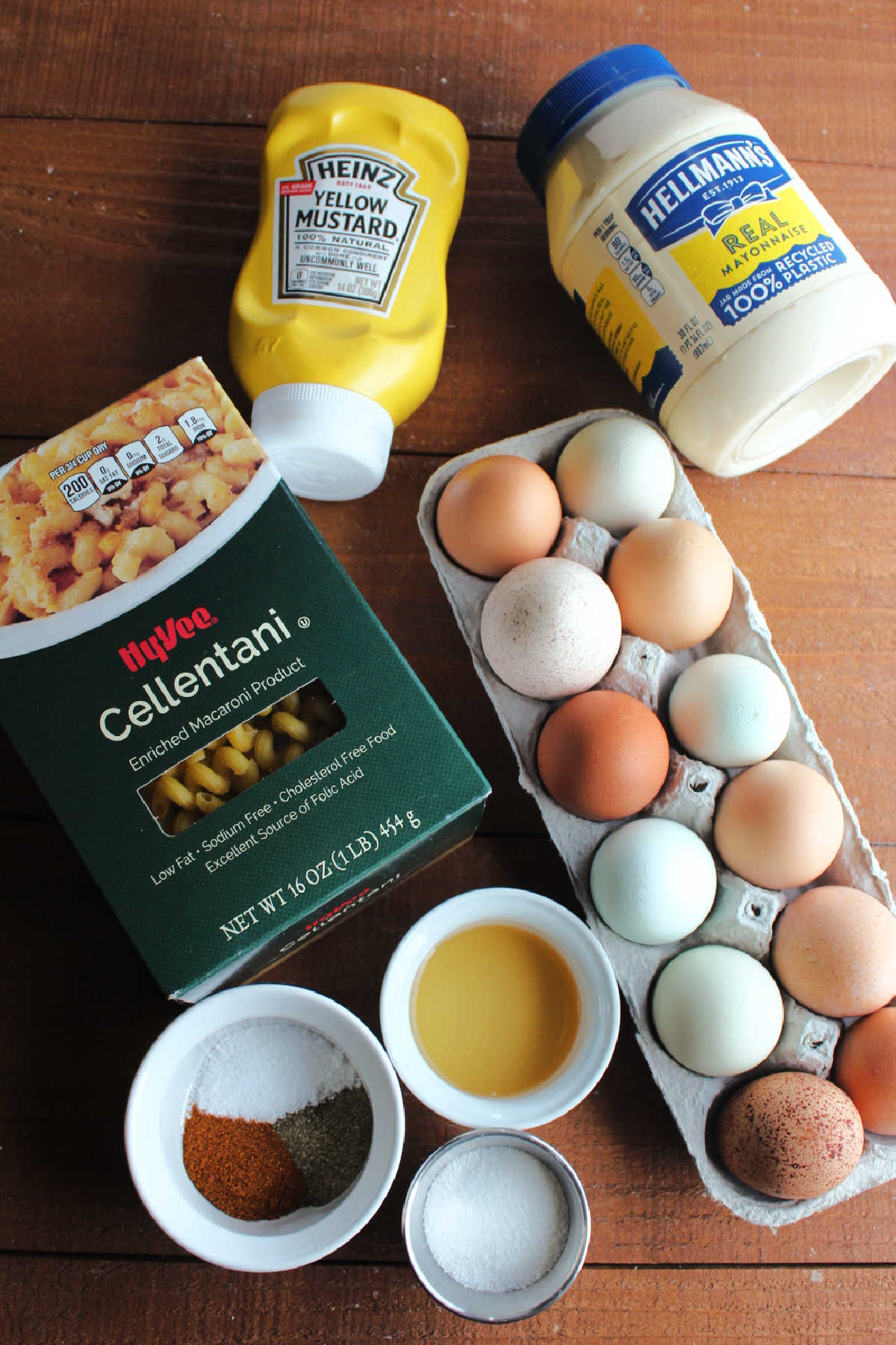 Ingredient shot: pasta, eggs, mayonnaise, mustard and seasonings ready to be made into pasta salad.