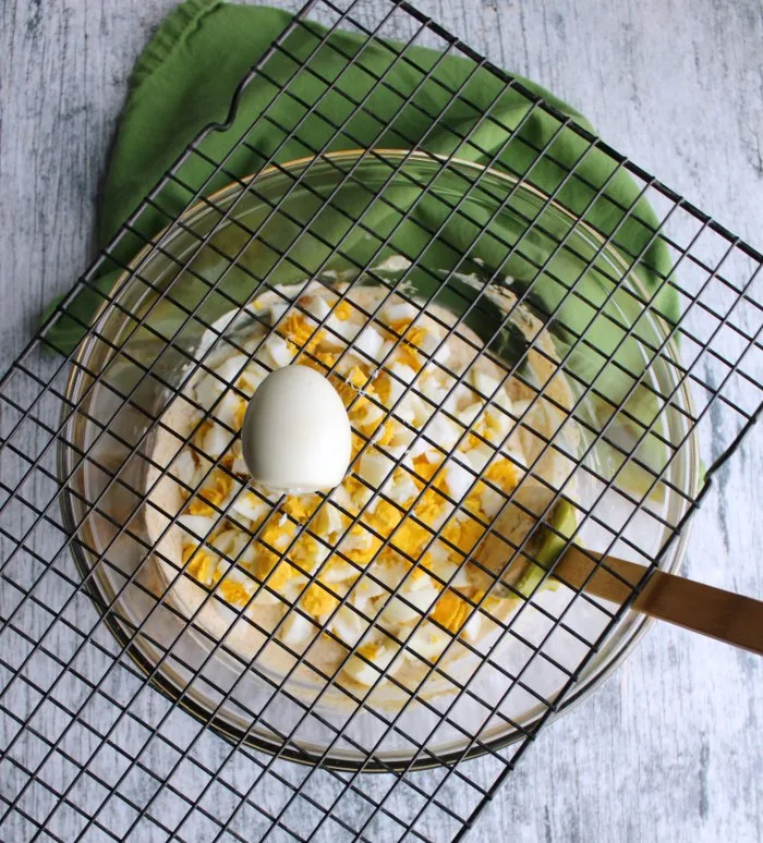 using squares of cooling rack to dice hard boiled eggs for salad.