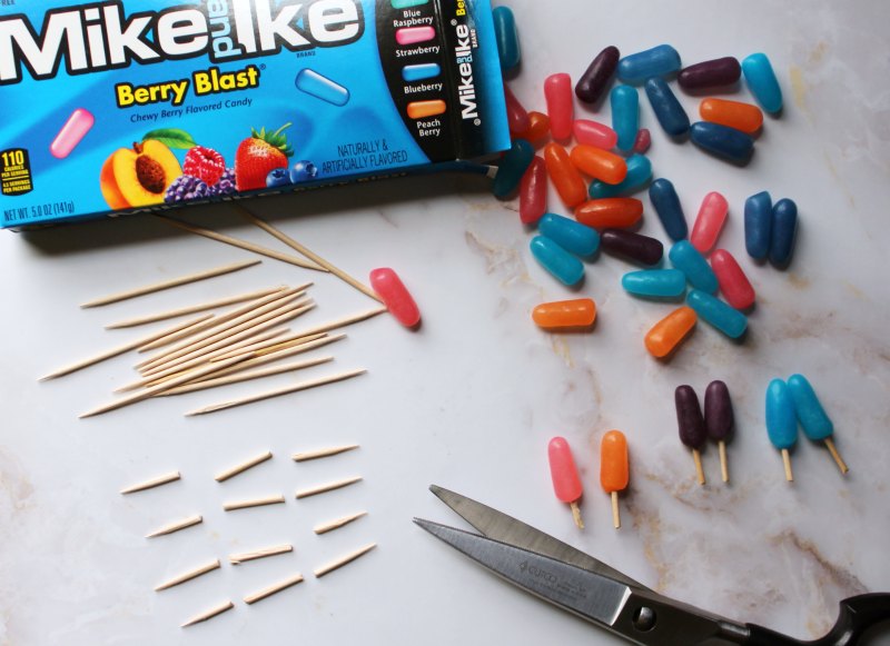 box of Mike and Ikes with cut toothpicks to look like little popsicles.