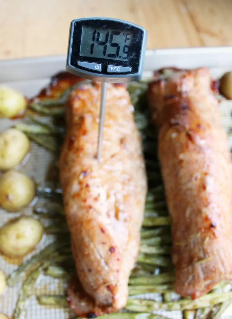 meat thermometer readying 145F in a pork tenderloin.