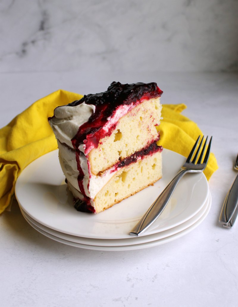 slice of blackberry shortcake cake served in small plate.