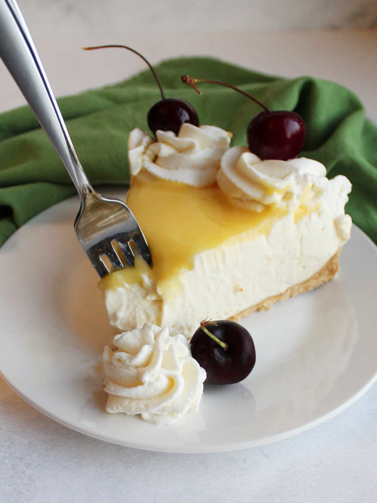 For getting bite of creamy no bake lemon cheesecake topped with lemon curd and fresh cherries.