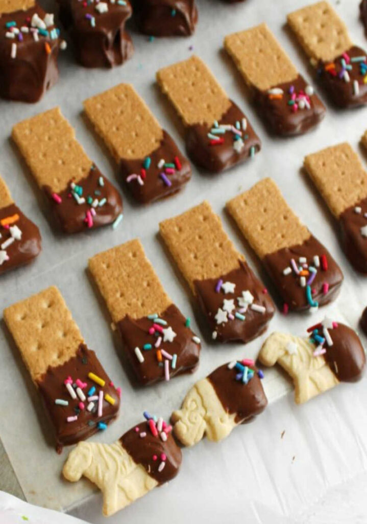 graham crackers and animal crackers dipped in chocolate and sprinkles for fun dippers for dessert dip.