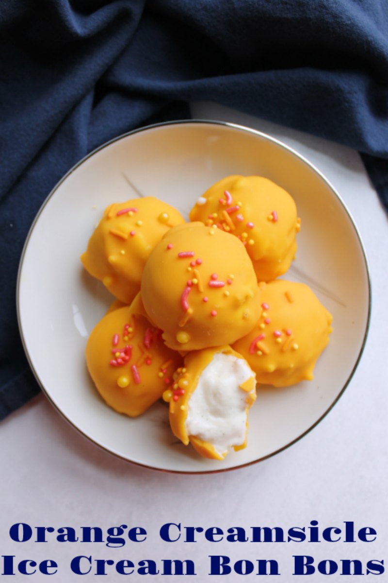 Orange creamsicle ice cream bon bons scream summer to me. As your teeth crack through the orange shell they sink into creamy vanilla ice cream. Never has making these citrus and vanilla treats been so easy to make. You’ll want to have them all summer long!