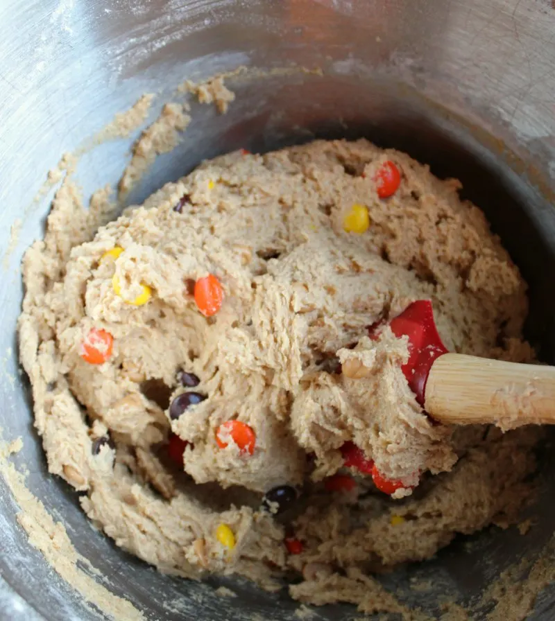 mixer bowl filled with triple peanut butter cookie dough, ready to bake.
