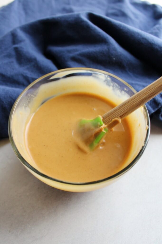 bowl of creamy 2 ingredient peanut butter magic shell
