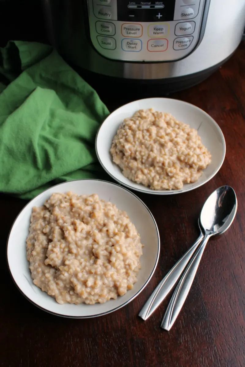 bowls of maple cinnamon steel cut oatmeal in front of instant pot pressure cooker.