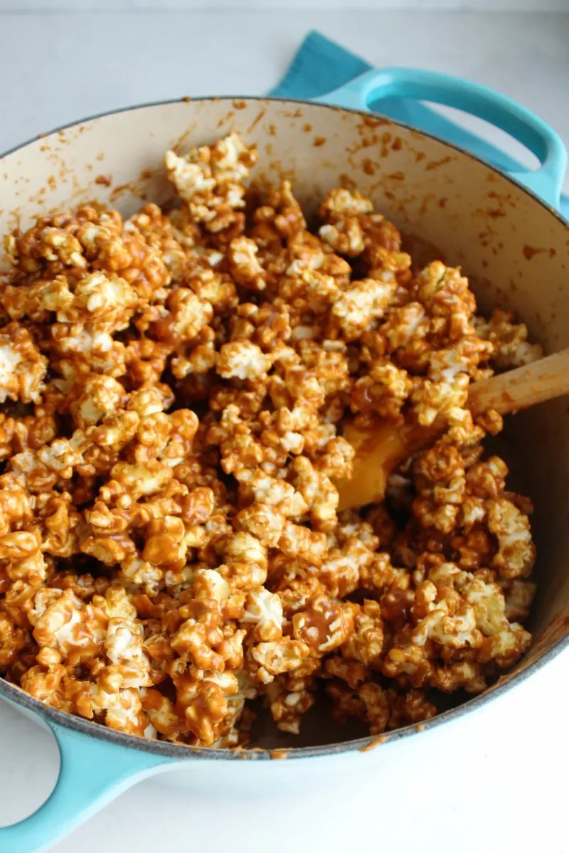 popcorn coated in apple flavored caramel ready to make popcorn balls.