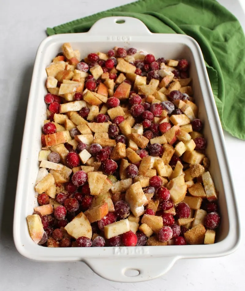 cranberries and apples tossed with brown sugar, cinnamon ready to bake into a crisp.