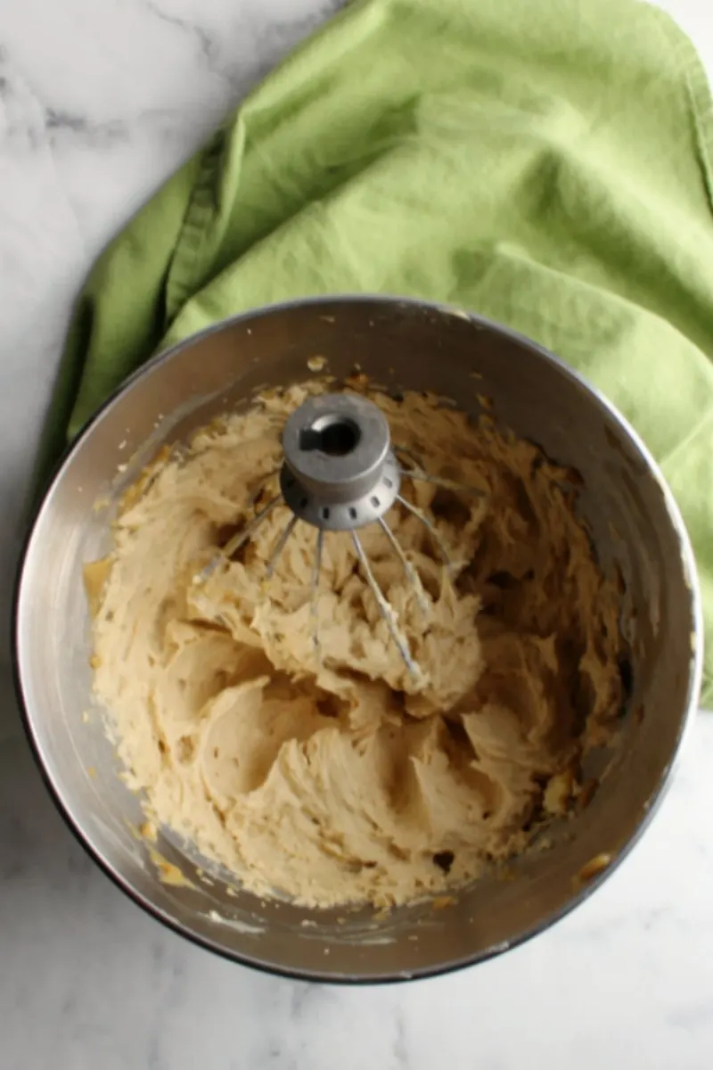 stand mixer bowl full of brown sugar German buttercream freshly whipped together