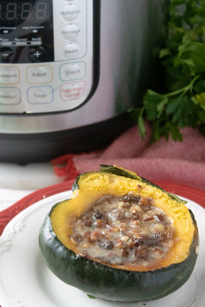 brown sugar and pecan stuffed acorn squash cooked in an instant pot.