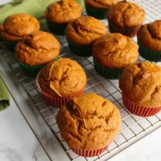 easy pumpkin cupcakes on cooling rack fresh from the oven.