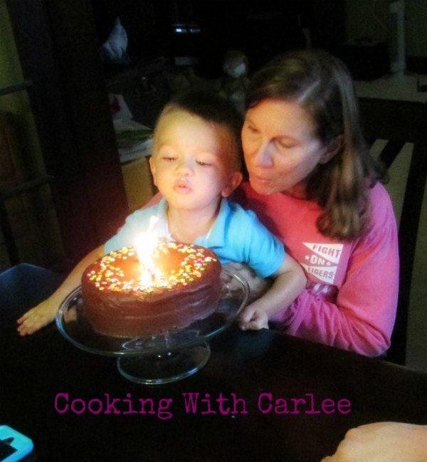 Mimi and Little Dude blowing out her birthday candles.