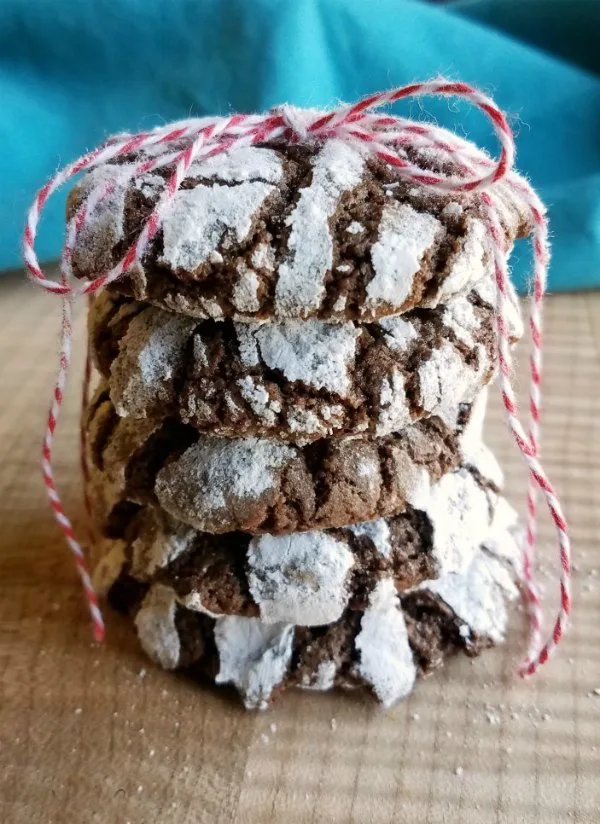 stack of chocolate crinkle cookies tied up with bakers twine.