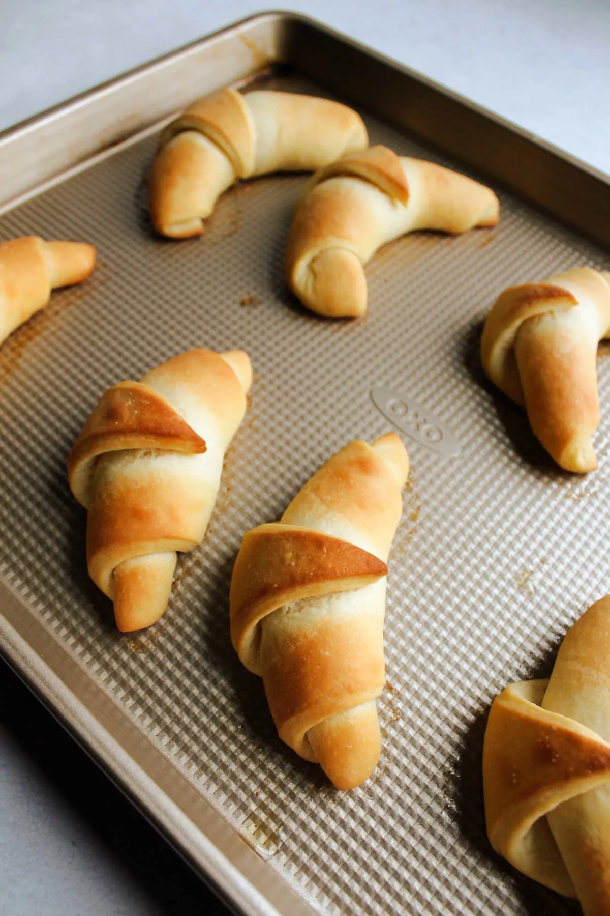 Homemade golden brown crescent rolls fresh from the oven.