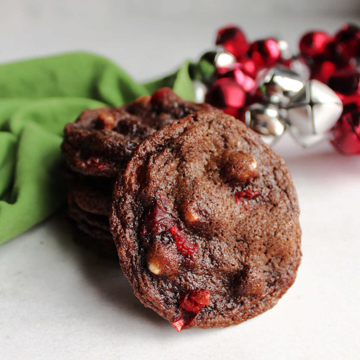 Chocolate cookie with white chips and bits of maraschino cherry baked inside.