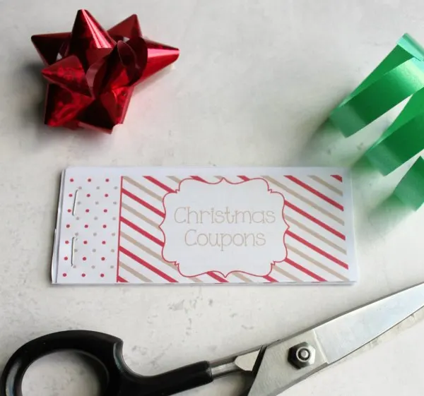 Assembled coupon book with scissors and a bows. 
