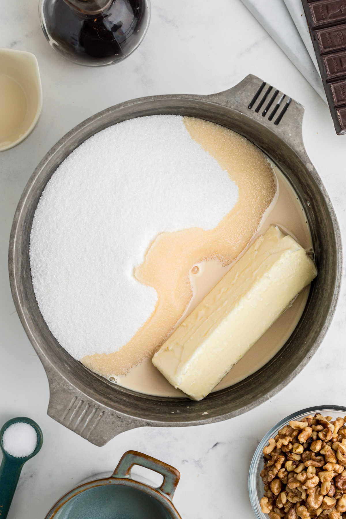 Butter, sugar, and evaporated milk in large heavy bottomed saucepan.