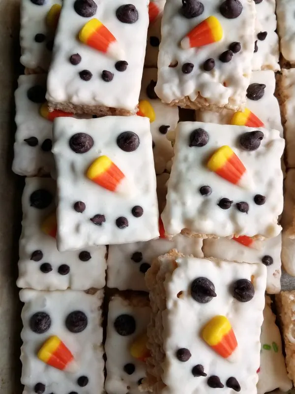 close stack of snowman decorated rice krispie treats.