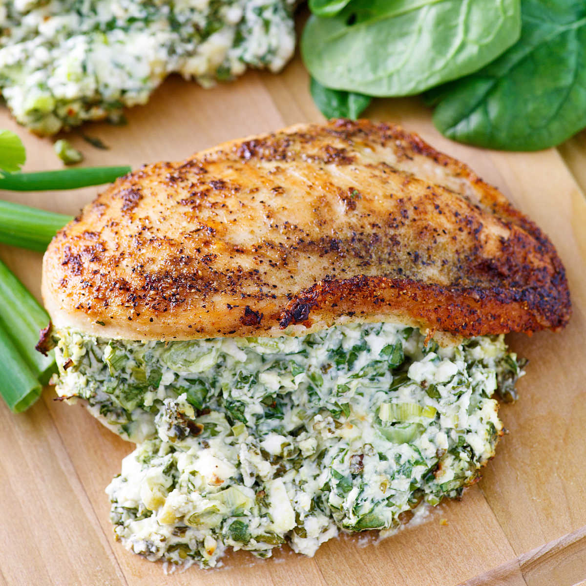 Nicely browned chicken breast stuffed with creamy spinach, green onion and cheese mixture.