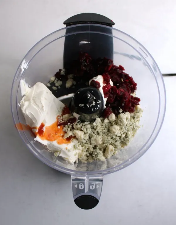 dried cranberries, cream cheese, blue cheese etc. in food processor.