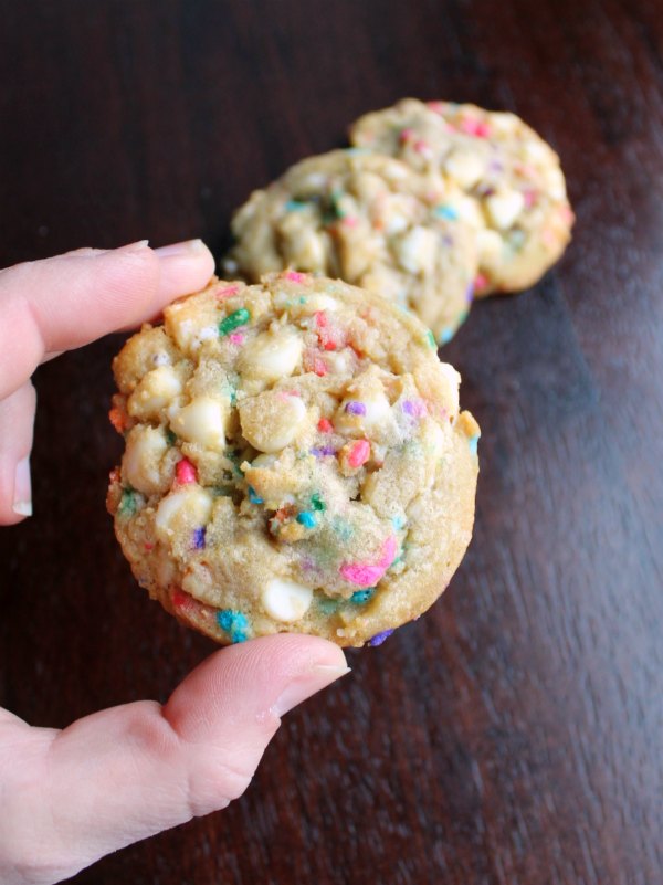 hand holding sprinkle and white chocolate chip cookie