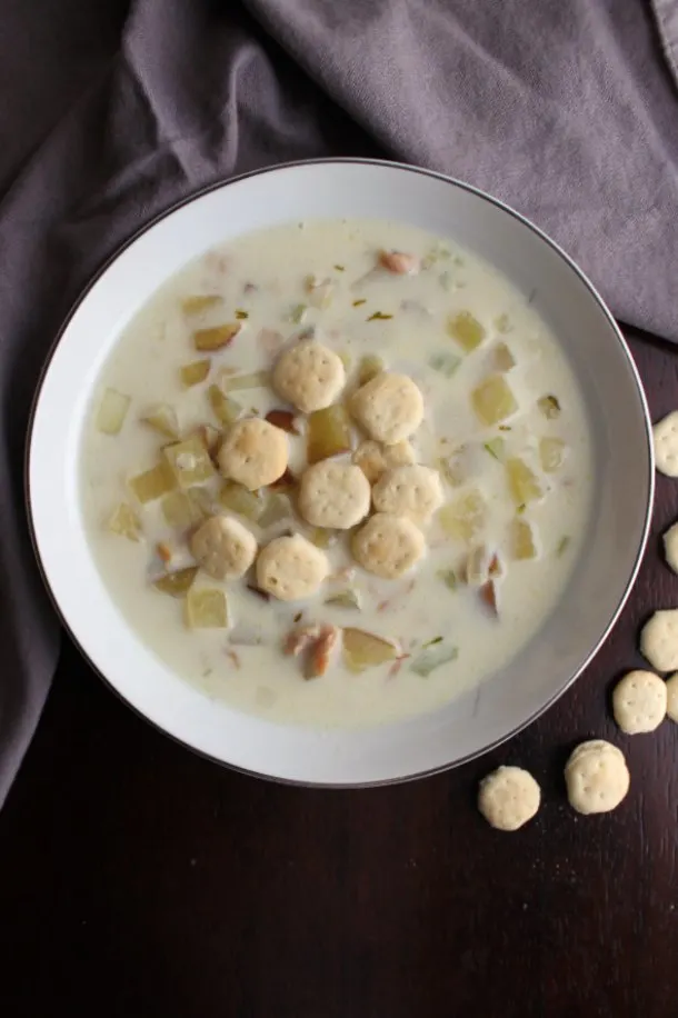 bowl of New England clam chowder with soup crackers