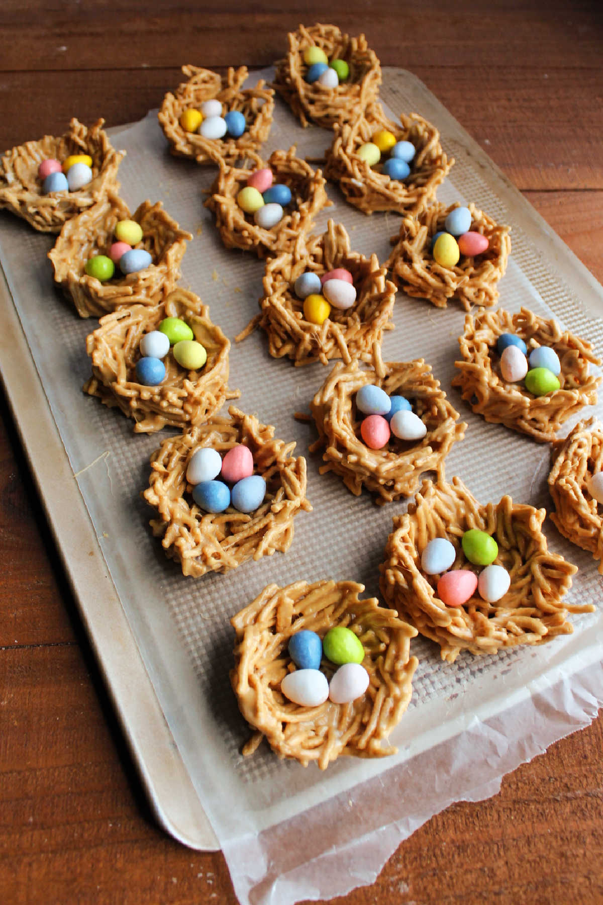 Tray of chow mein nests filled with chocolate and peanut butter candy eggs. 
