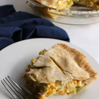 slice of pot pie filled with ham cheese and broccoli ready to eat