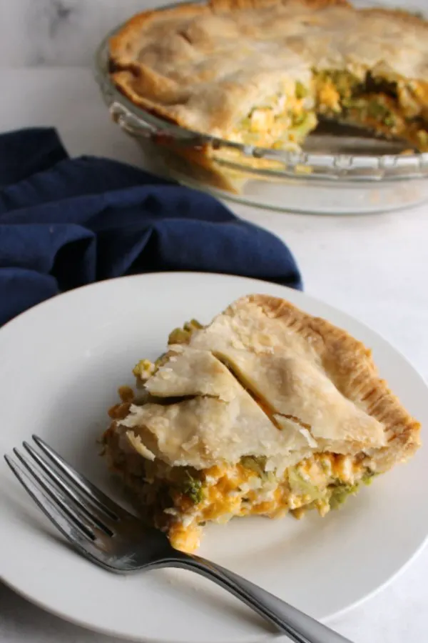 bite missing from slice of ham broccoli and cheese pot pie