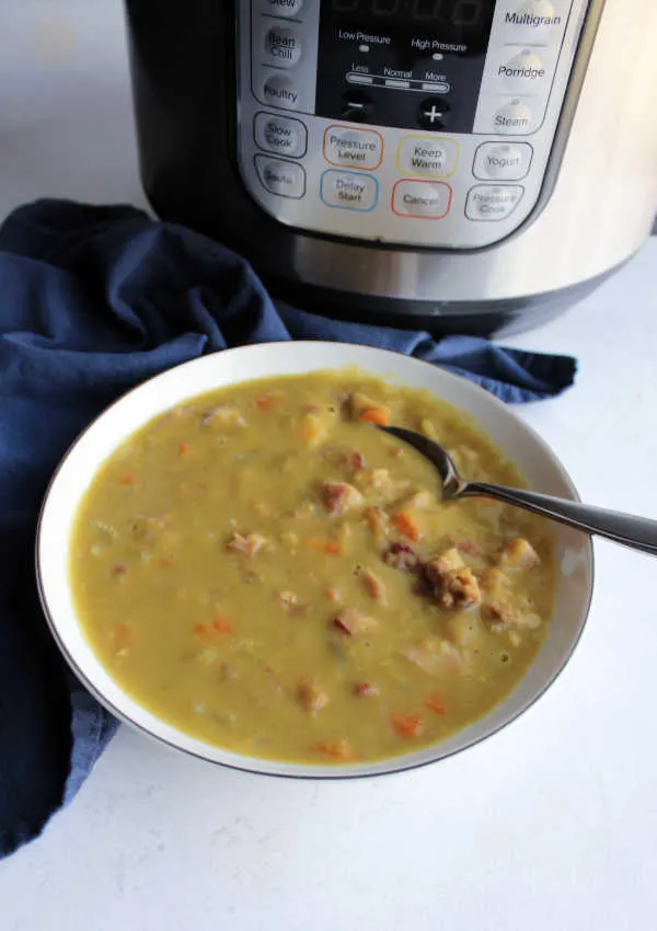 Turn a ham bone and bag of dry split peas into a hearty soup in a fraction of the time with the help of a pressure cooker. This recipe will have you sitting down to a bowl of warm comforting goodness before you know it.