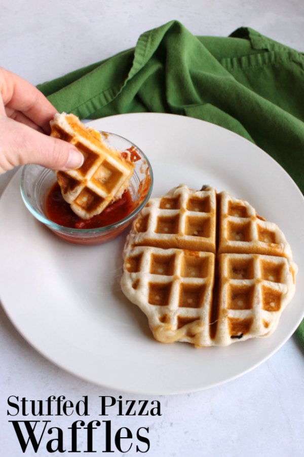 Golden savory waffles stuffed with gooey cheese and pepperoni with marinara dipping sauce are a new favorite way to enjoy your favorite pizza flavors. They can be made with 3 ingredients and in 15 minutes. You'll be dunking them in sauce in no time!