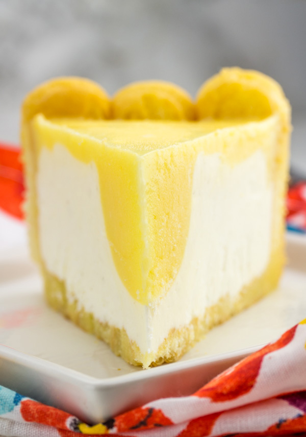 looking across a slice of cheesecake with orange topping showing.
