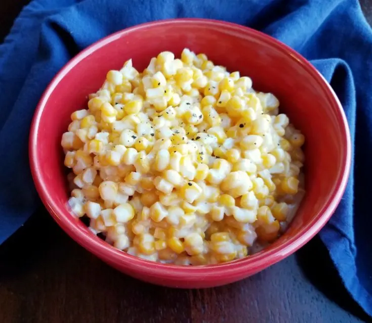 Bowl of creamy slow cooker corn ready to eat.