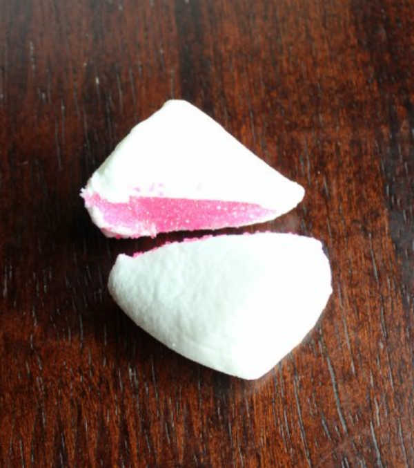 marshmallow cut in half and dipped in pink sugar to make rabbit ears.