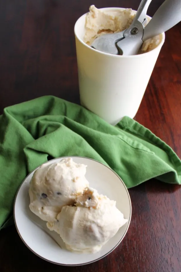 cookie dough ice cream scooped from container into small bowl