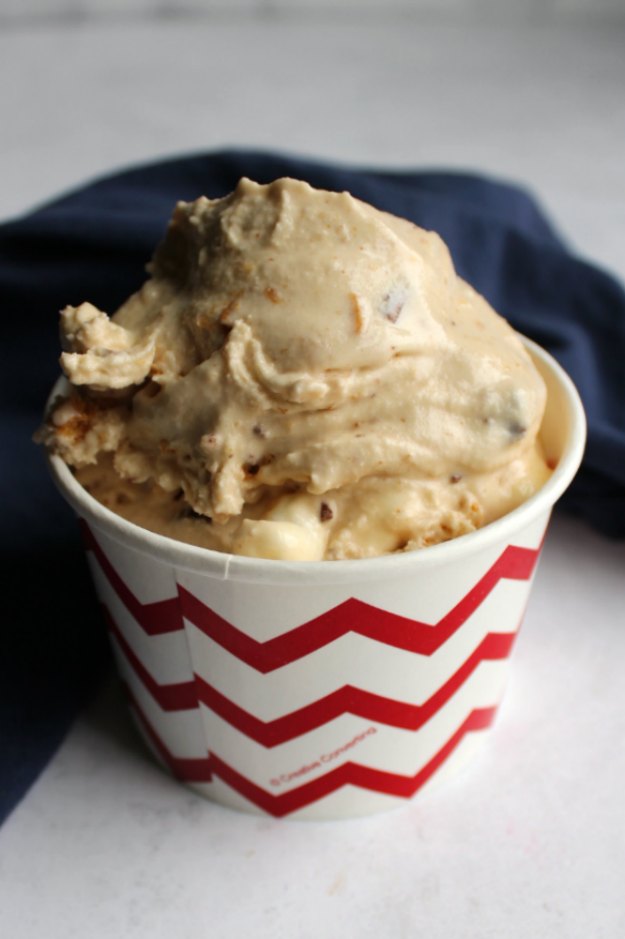 scoop of s'mores ice cream with toasted marshmallow base in chevron cup